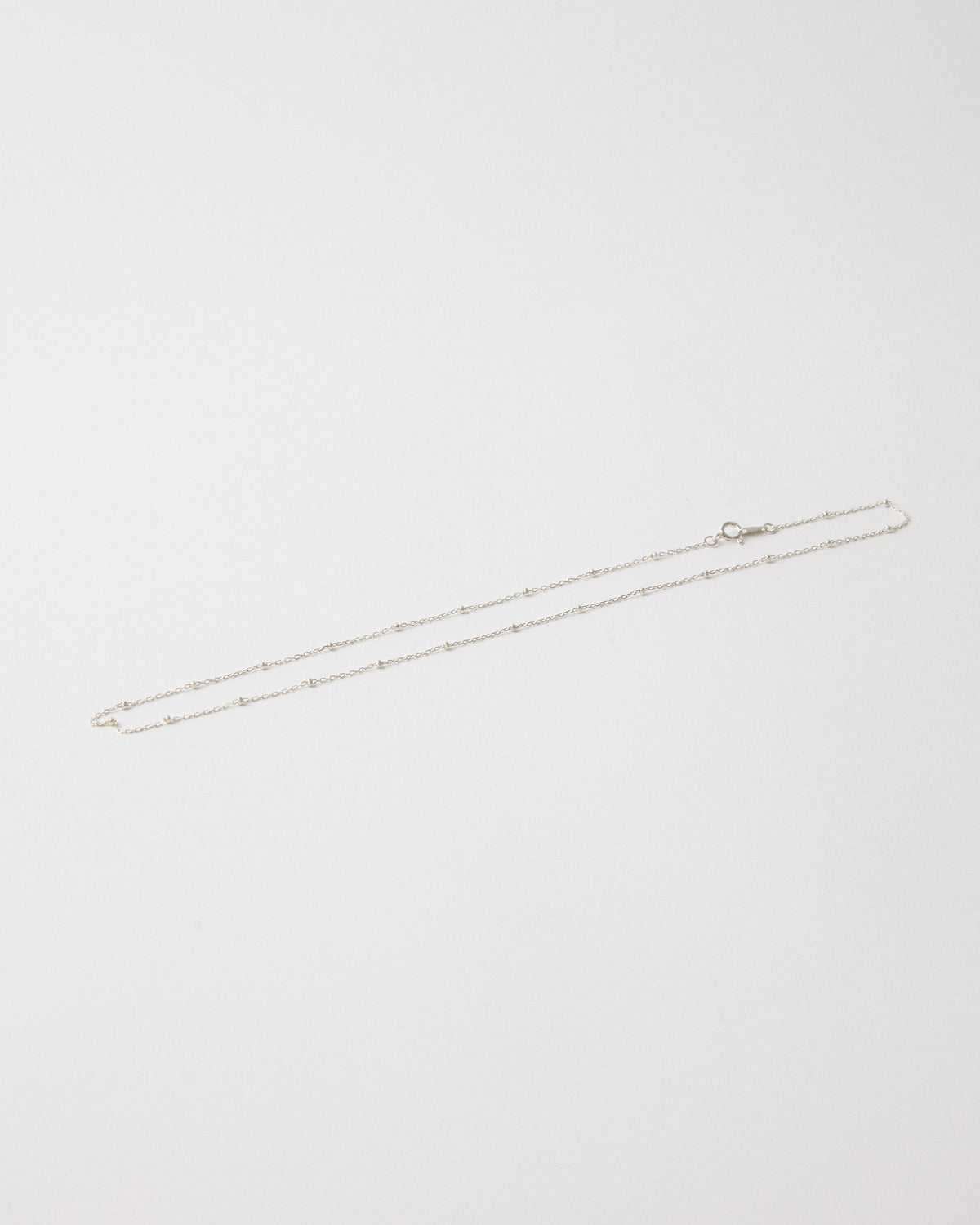 Silver ball station chain necklace laid flat with clasp – HANNA543 N1057 starlit dot chain