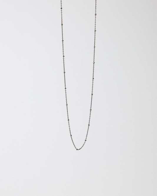 Antique silver ball station chain necklace hanging on a light gray background – HANNA543 N1057 starlit dot chain