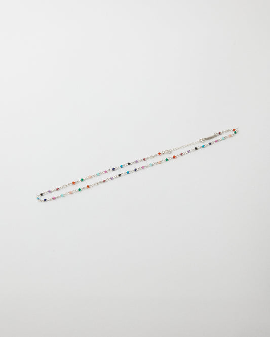 Hanging sterling silver gemstone necklace with rainbow-colored stone accents