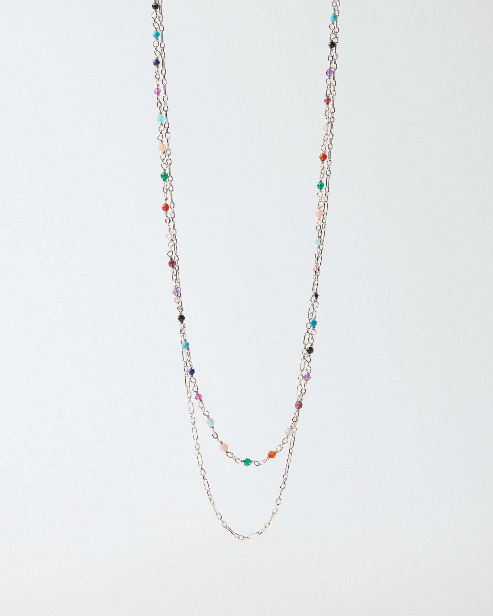 Hanging layered sterling silver necklace with multicolor gemstone accents