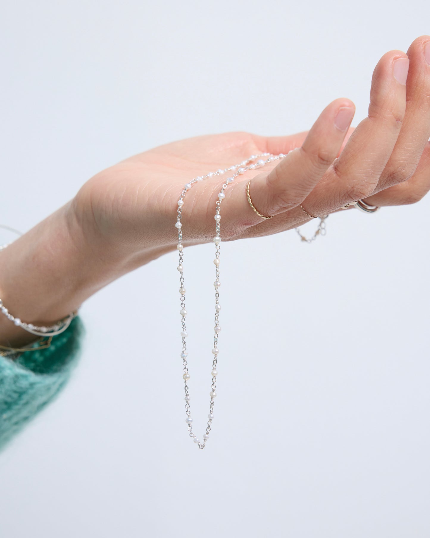 a close side view showing how light and natural the necklace feels