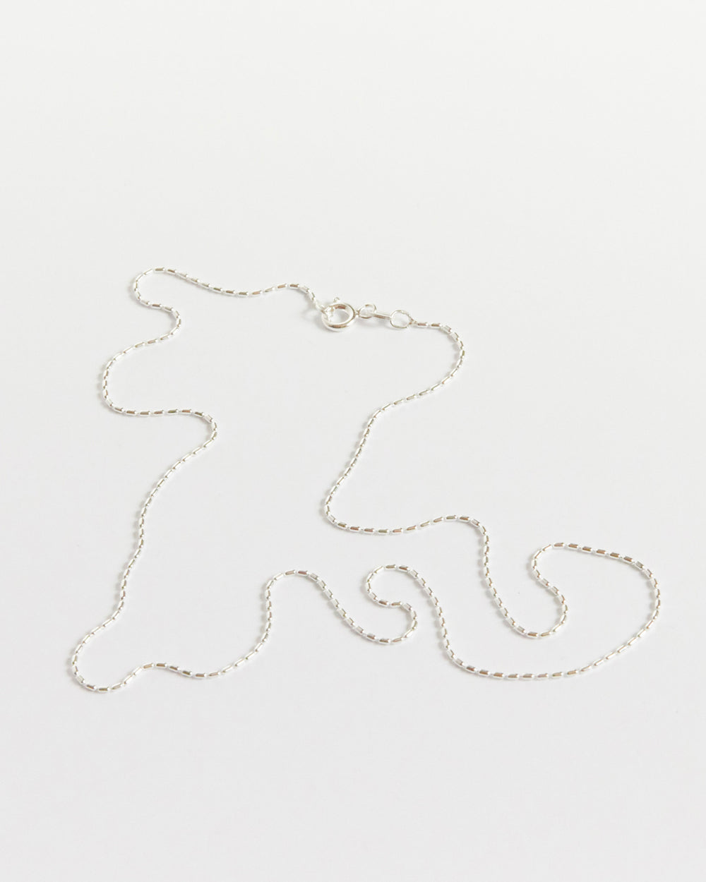 the kind of detailed silver chain that makes people look twice (and then ask where it’s from)