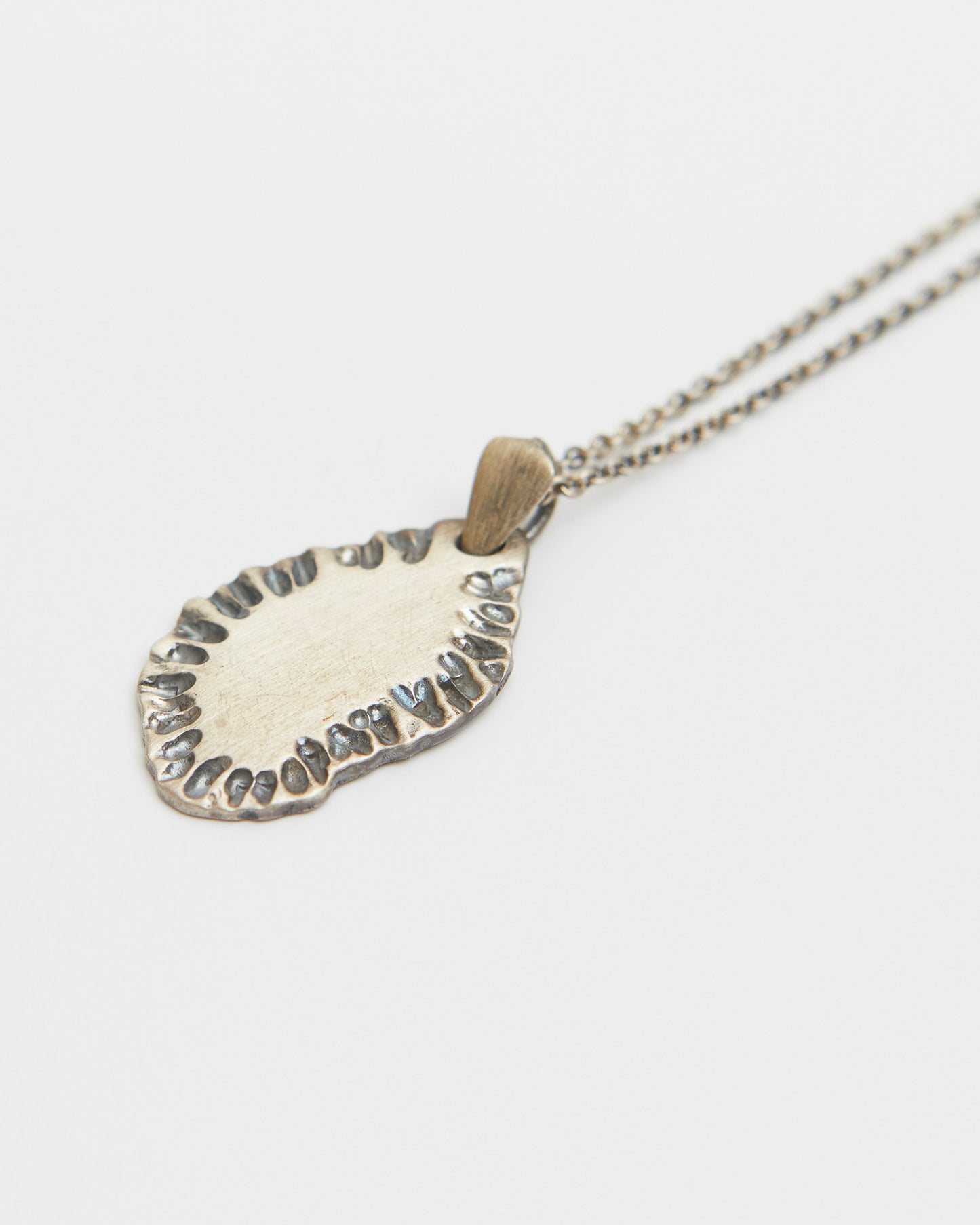 N502 - etched tide pendant