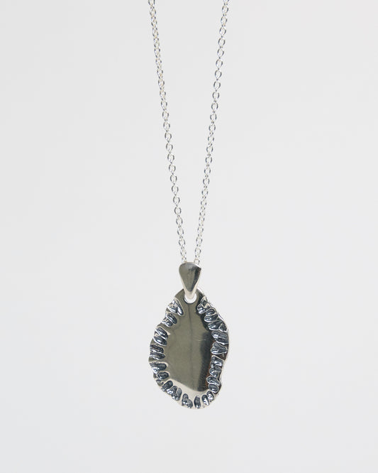 N502 - etched tide pendant