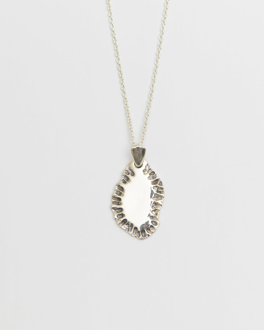 N502 - etched tide pendant