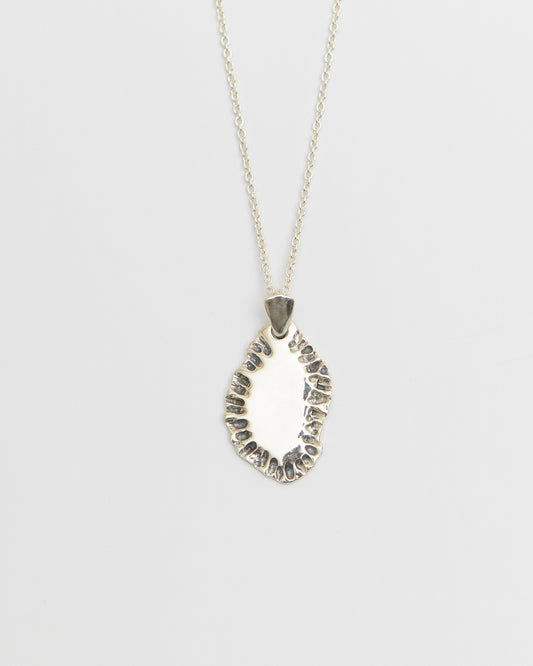 N502 - etched tide pendant