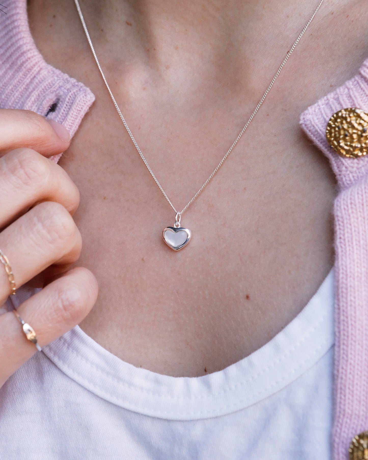delicate silver heart pendant necklace with natural pearl luster