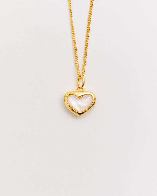gold heart necklace featuring mother of pearl inlay, delicate chain on white background