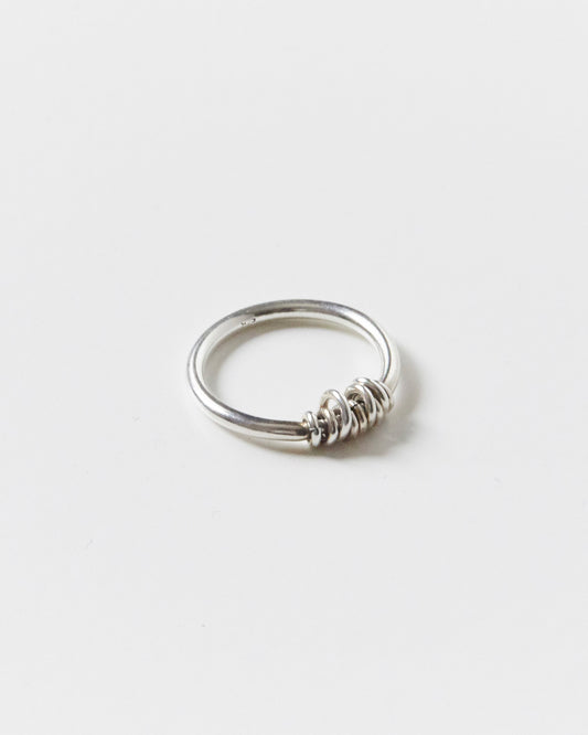 stacked sterling silver rings casually stealing attention while pretending to be effortless