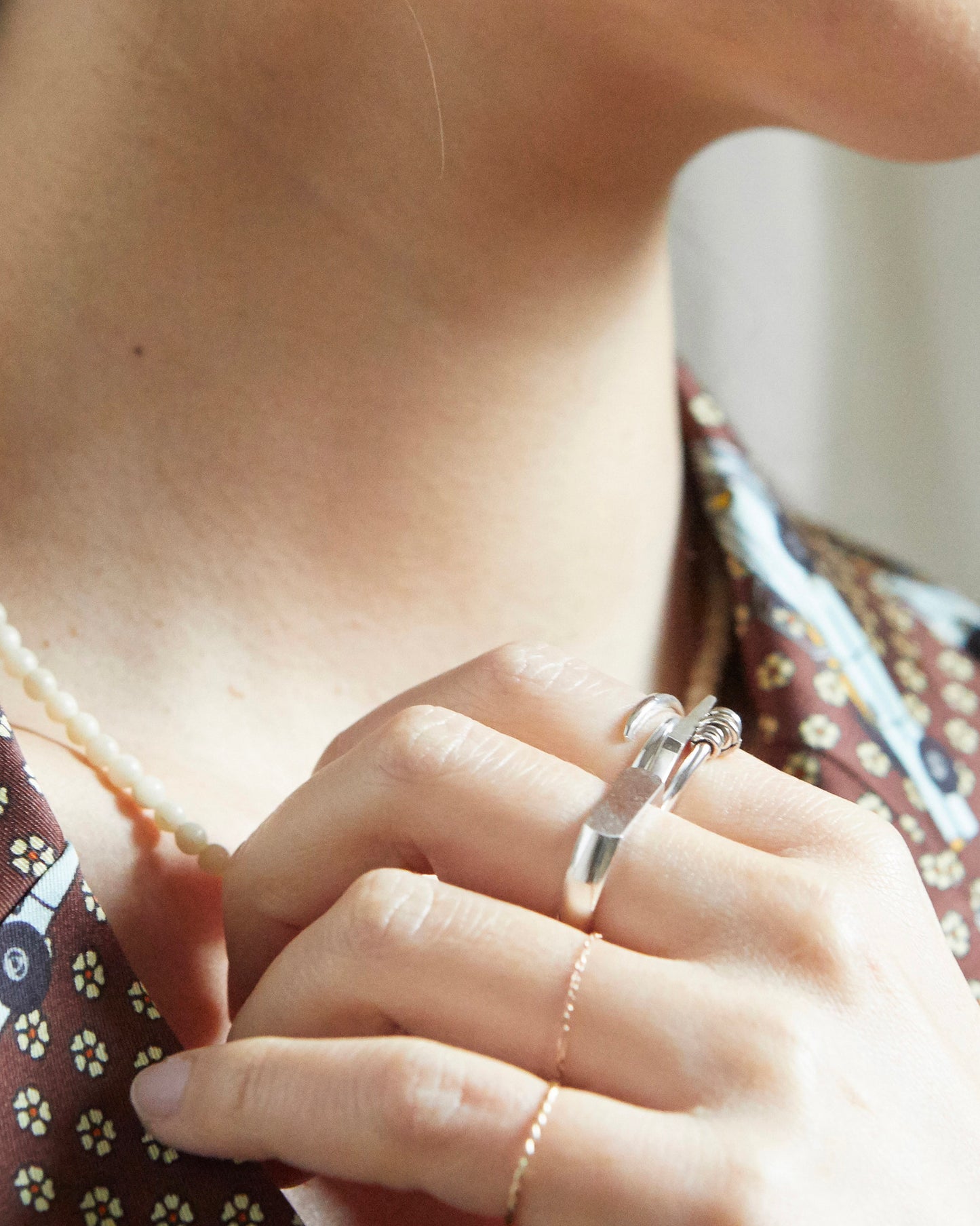 a tiny architectural moment disguised as a silver ring