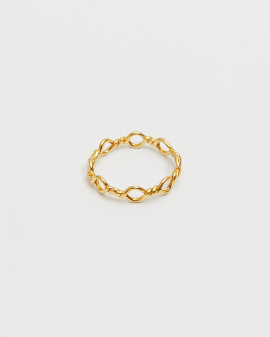 architectural gold ring composed of interlinked loop forms, geometric and minimal design