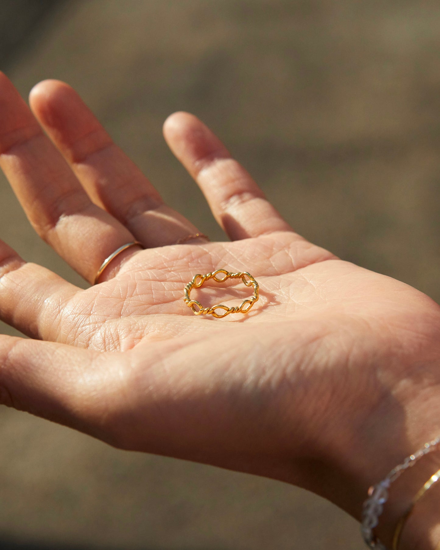polished gold loop ring highlighting smooth texture and refined metal surface