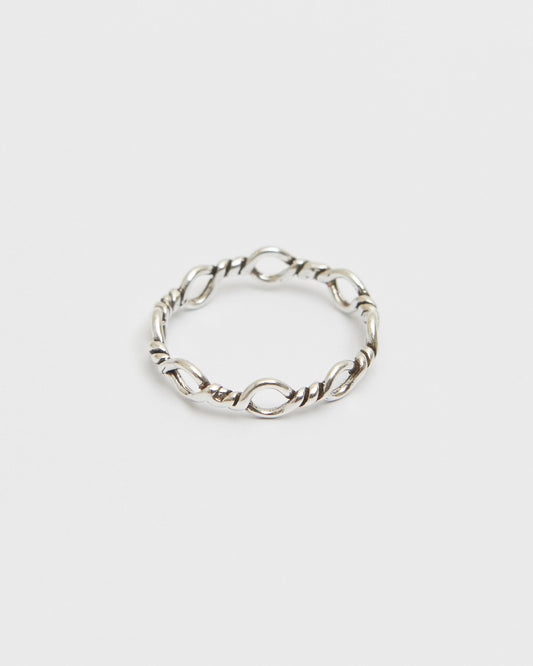 architectural silver ring composed of interlinked loop forms, geometric and minimal design