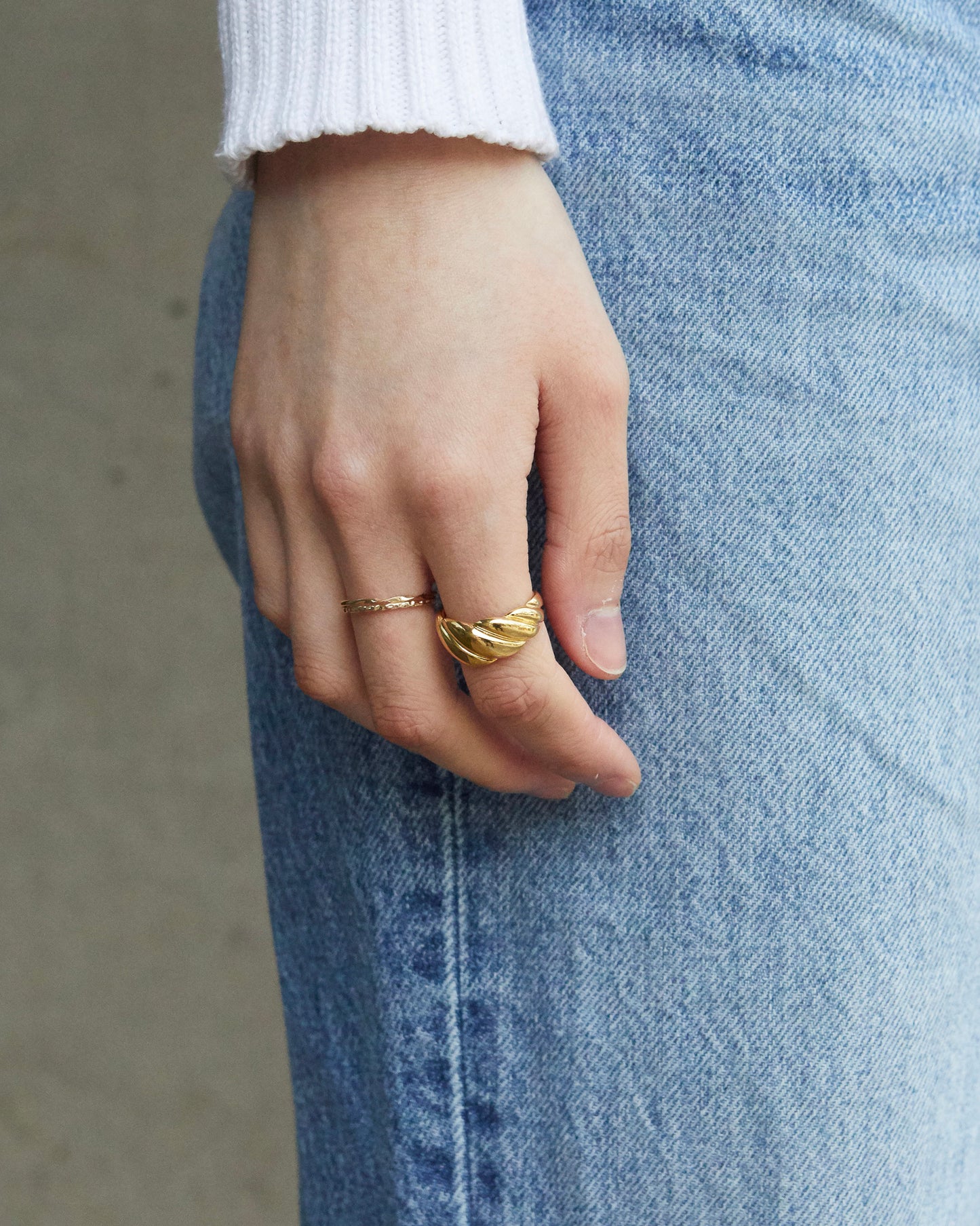 conceptual twisted ring with sculptural form and continuous metal rotation