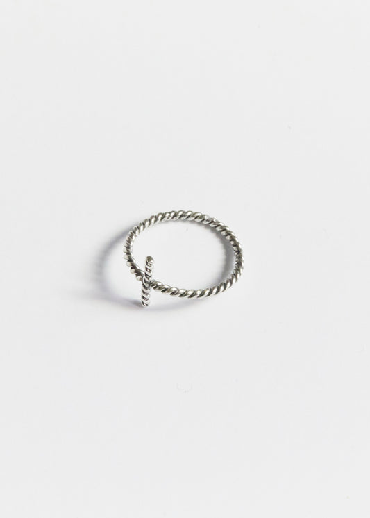 a tiny cross ring quietly doing all the emotional heavy lifting